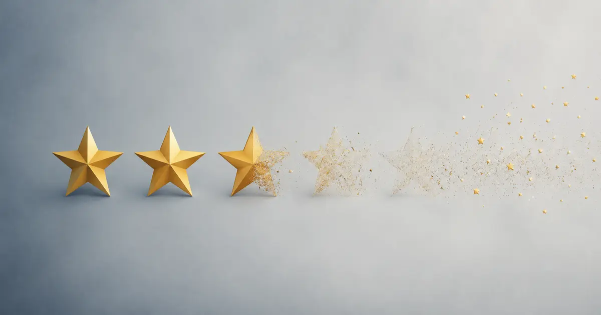 Row of five star ratings fading and dissolving into particles from left to right.